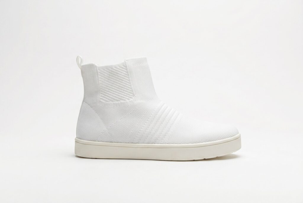 White knit boot product photo for footwear ecommerce category visuals