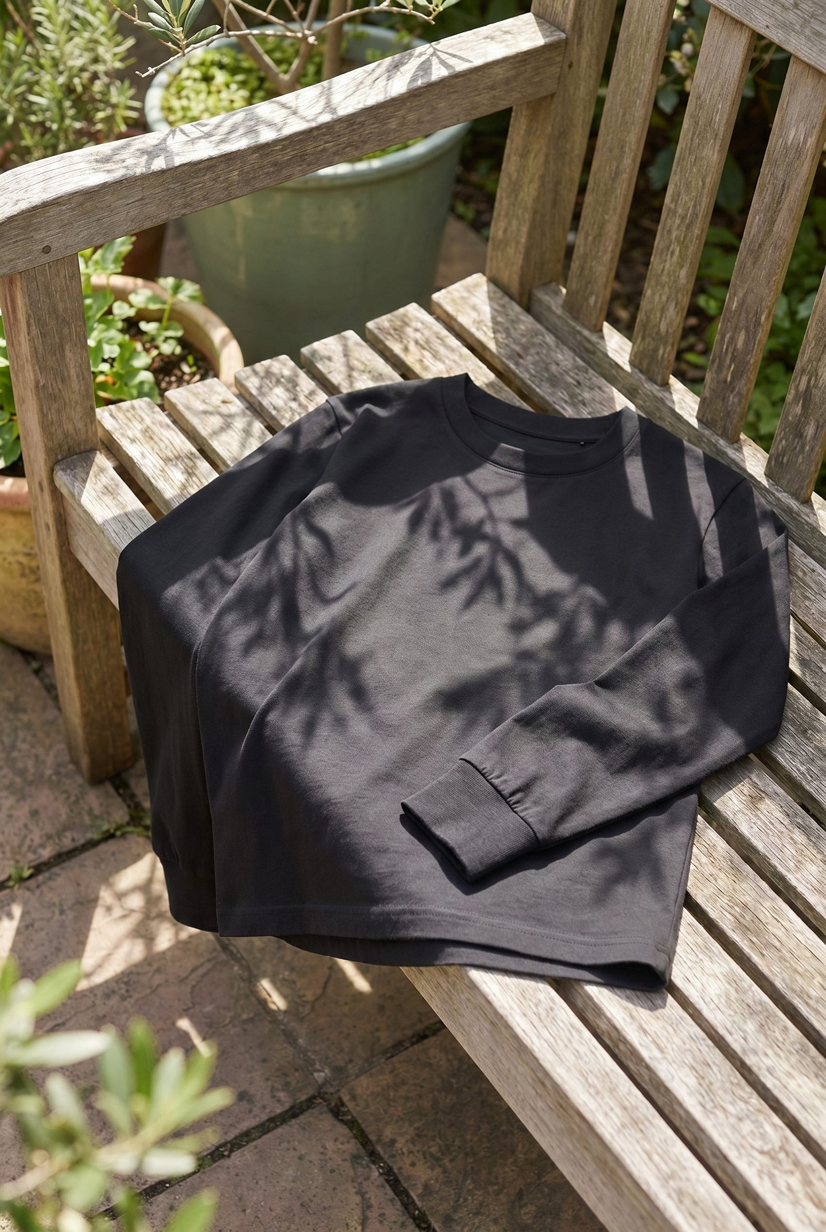 Google Shopping product images example showing a black shirt feed image