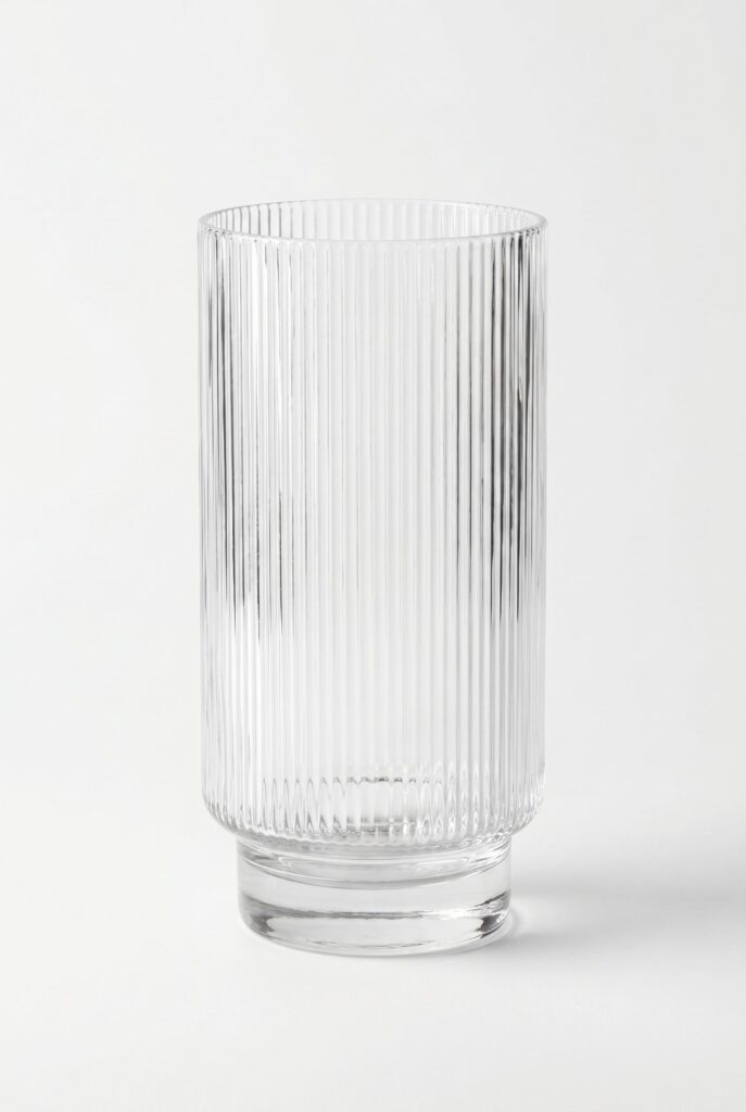 Clear ribbed tumbler against a light background.