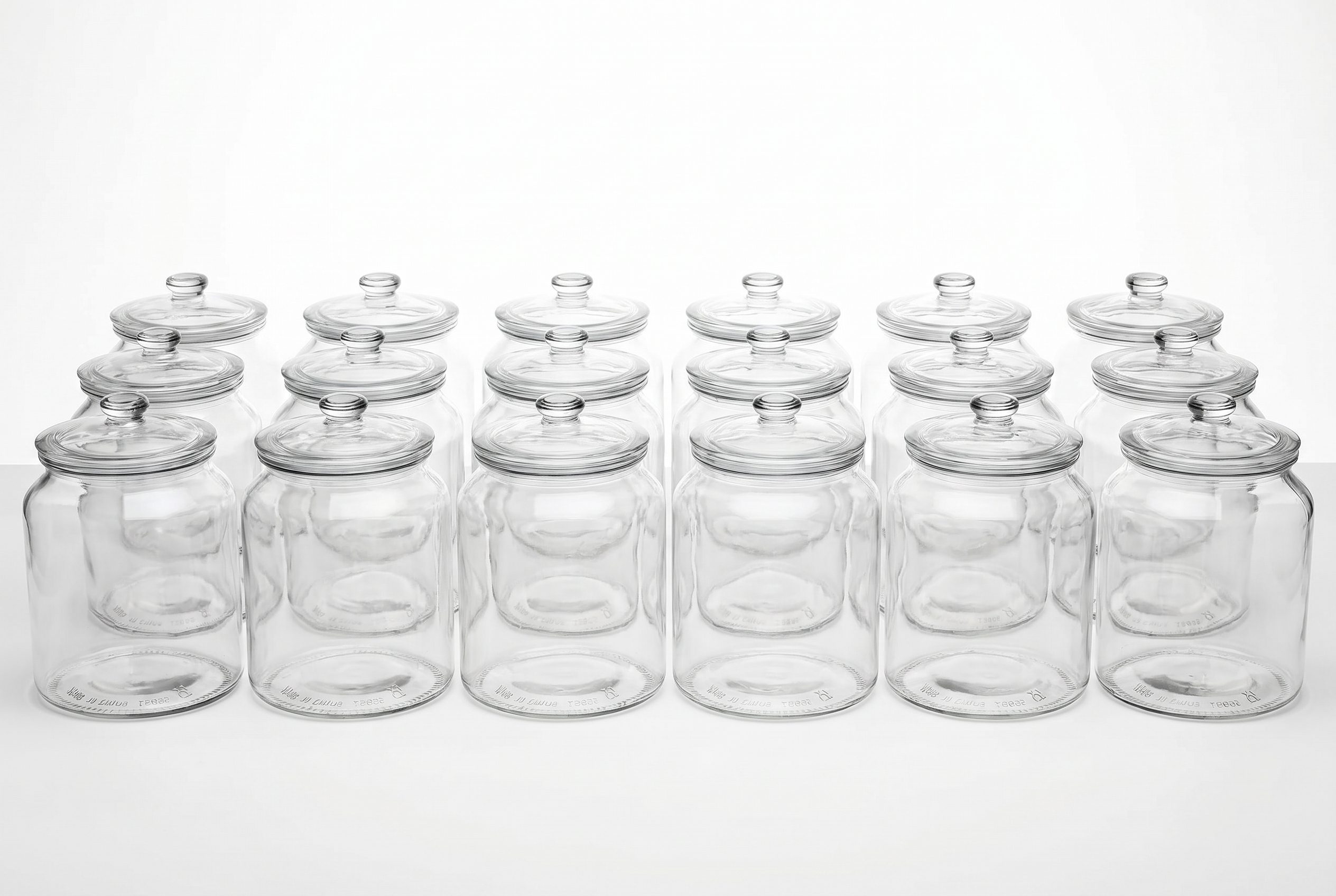 Fotogenic AI bulk product photography showing a clean catalog row of glass jars