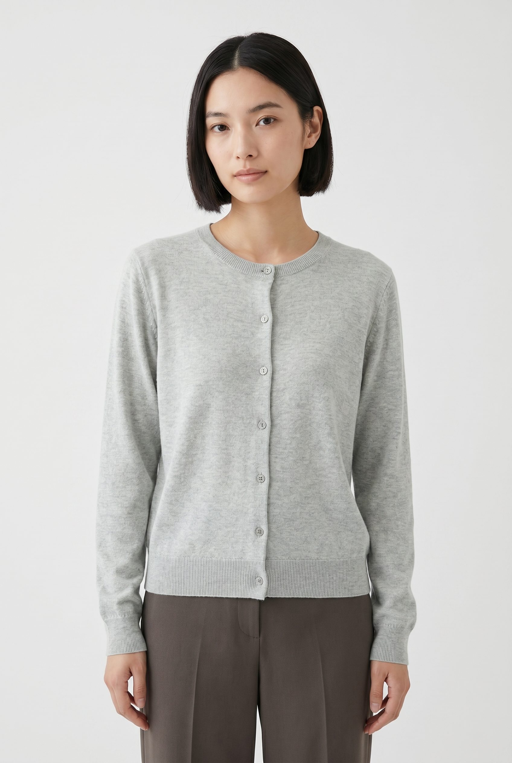 Shopify product photography example showing a gray cardigan apparel scene