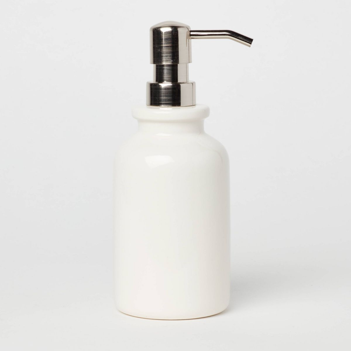 Original ecommerce product input photo of a ceramic soap pump before Fotogenic AI generation