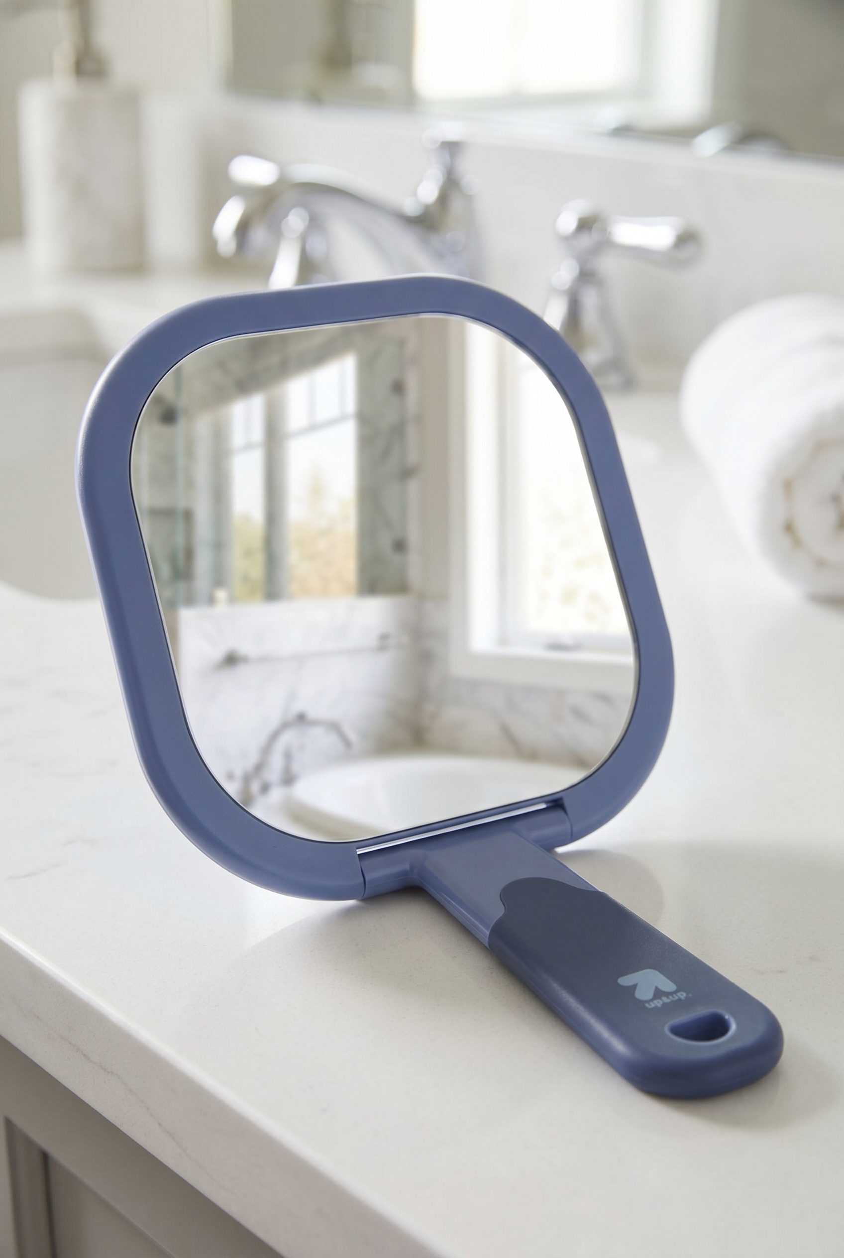 Fotogenic AI product image generator beauty example showing a handheld makeup mirror in a clean ecommerce scene