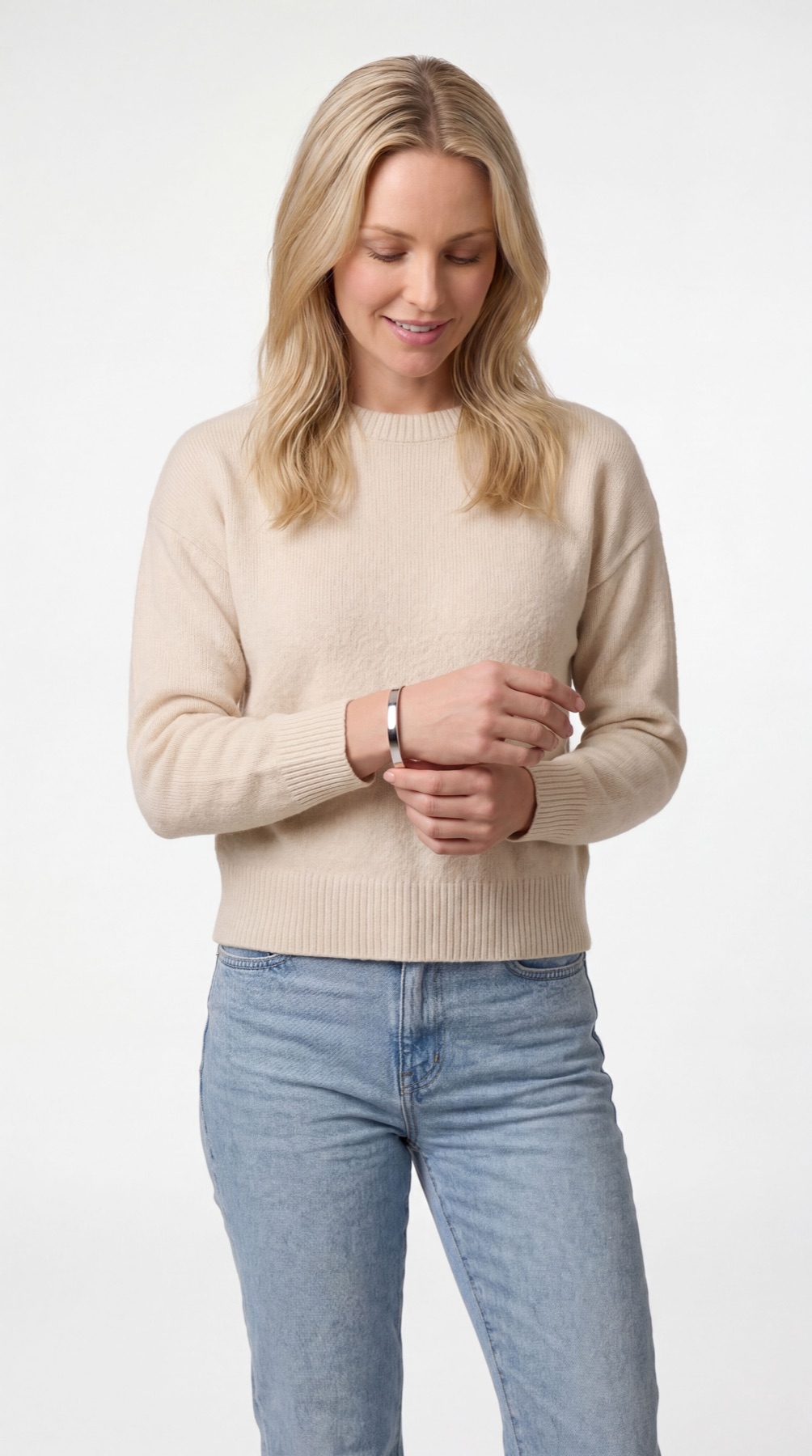 Fotogenic AI apparel product photography hero example showing a sweater on an adult model with clean ecommerce styling.