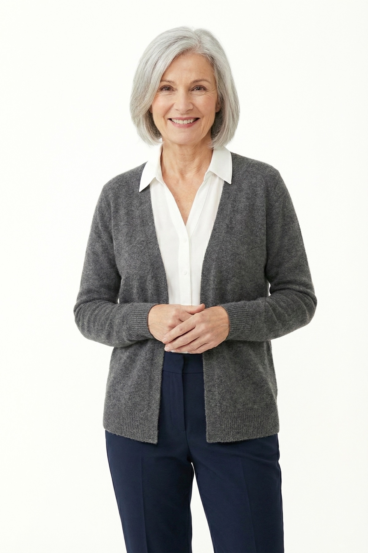 Fotogenic AI apparel product photography hero example showing a mature adult model in a gray cardigan for catalog-ready clothing visuals.