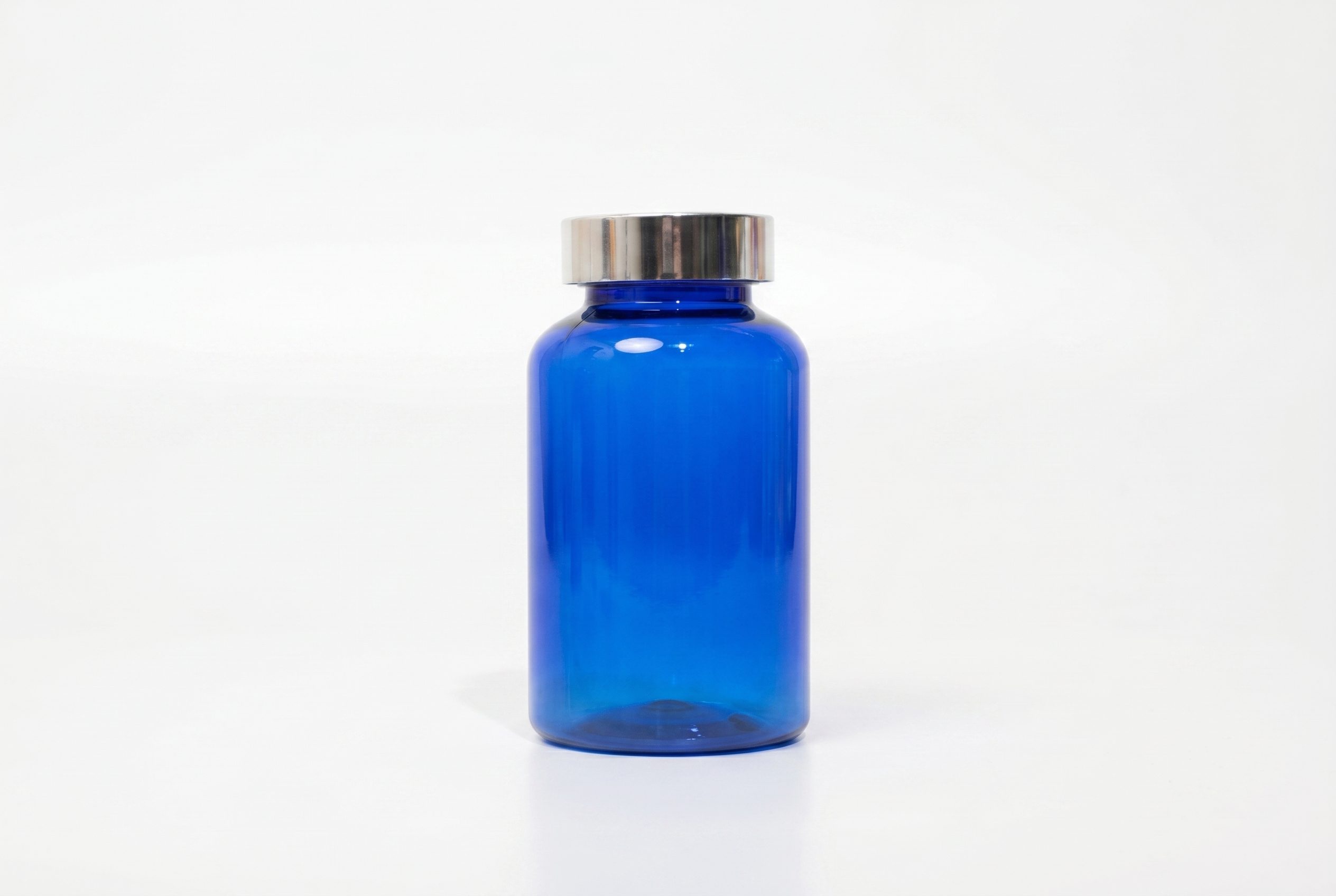 Fotogenic AI supplement product photography blue bottle PDP hero