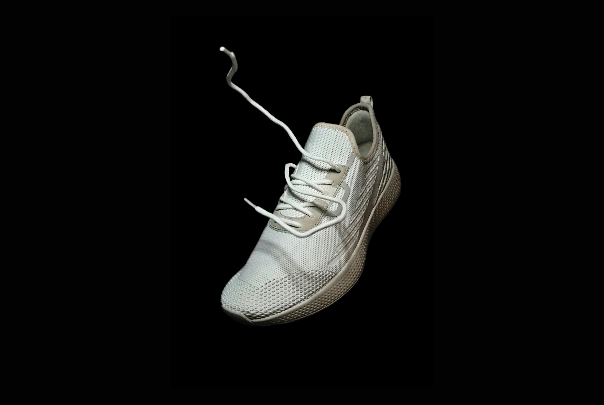 White knit sneaker catalog product image for footwear ecommerce visuals