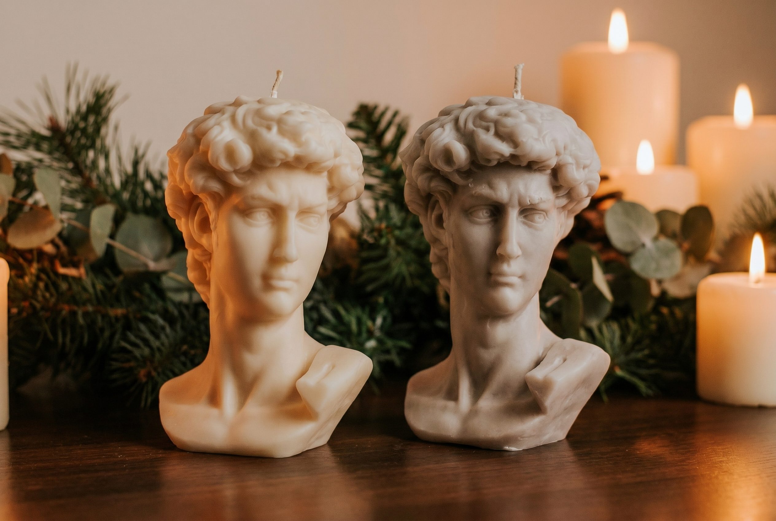 AI background generator output showing sculptural candles in a seasonal ecommerce scene