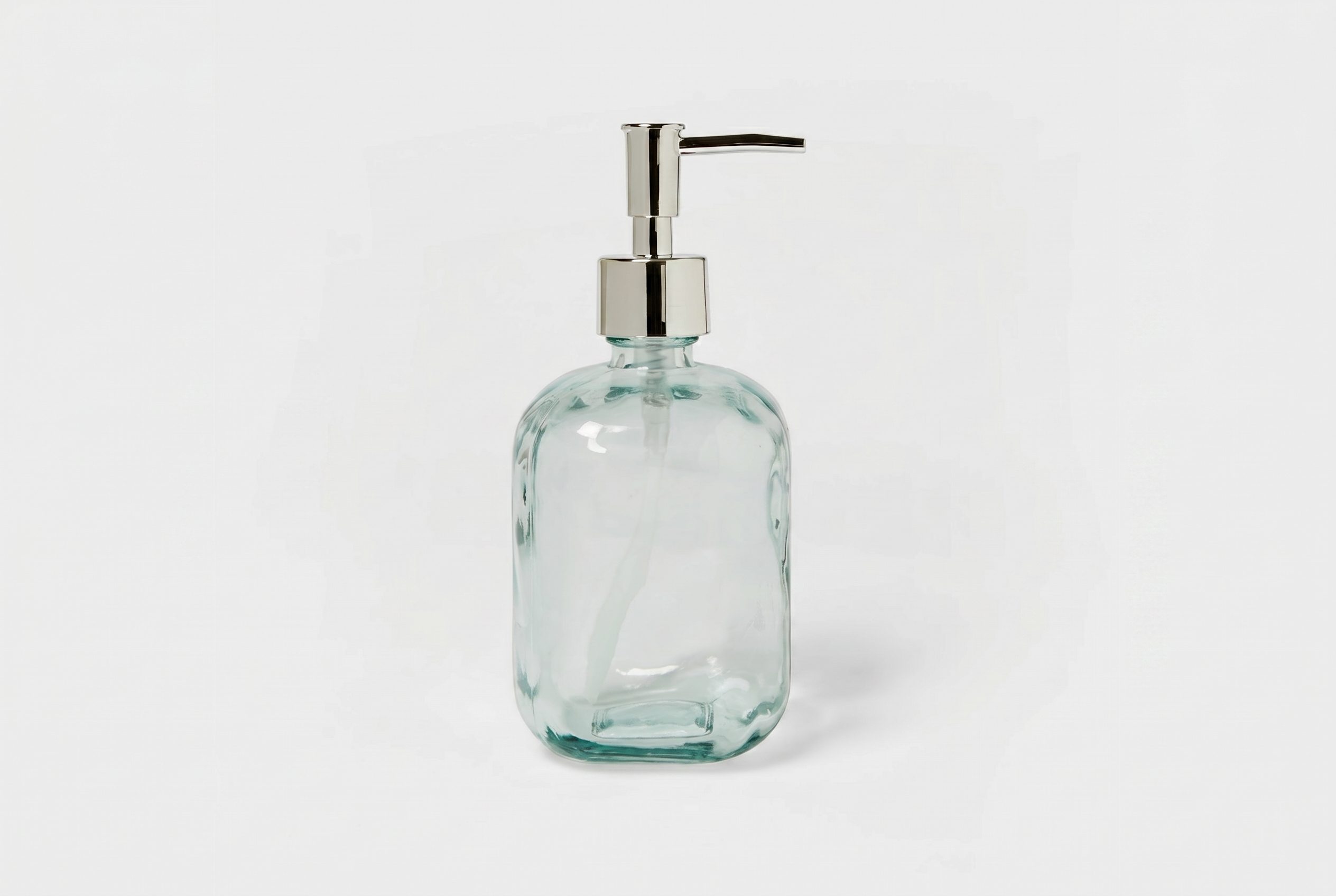 White background product photos output showing the same glass soap dispenser on a clean white catalog background