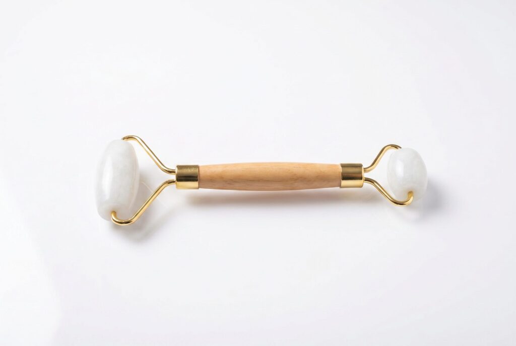 Jade facial roller on a clean white studio background for prepared for marketplace review beauty photos.