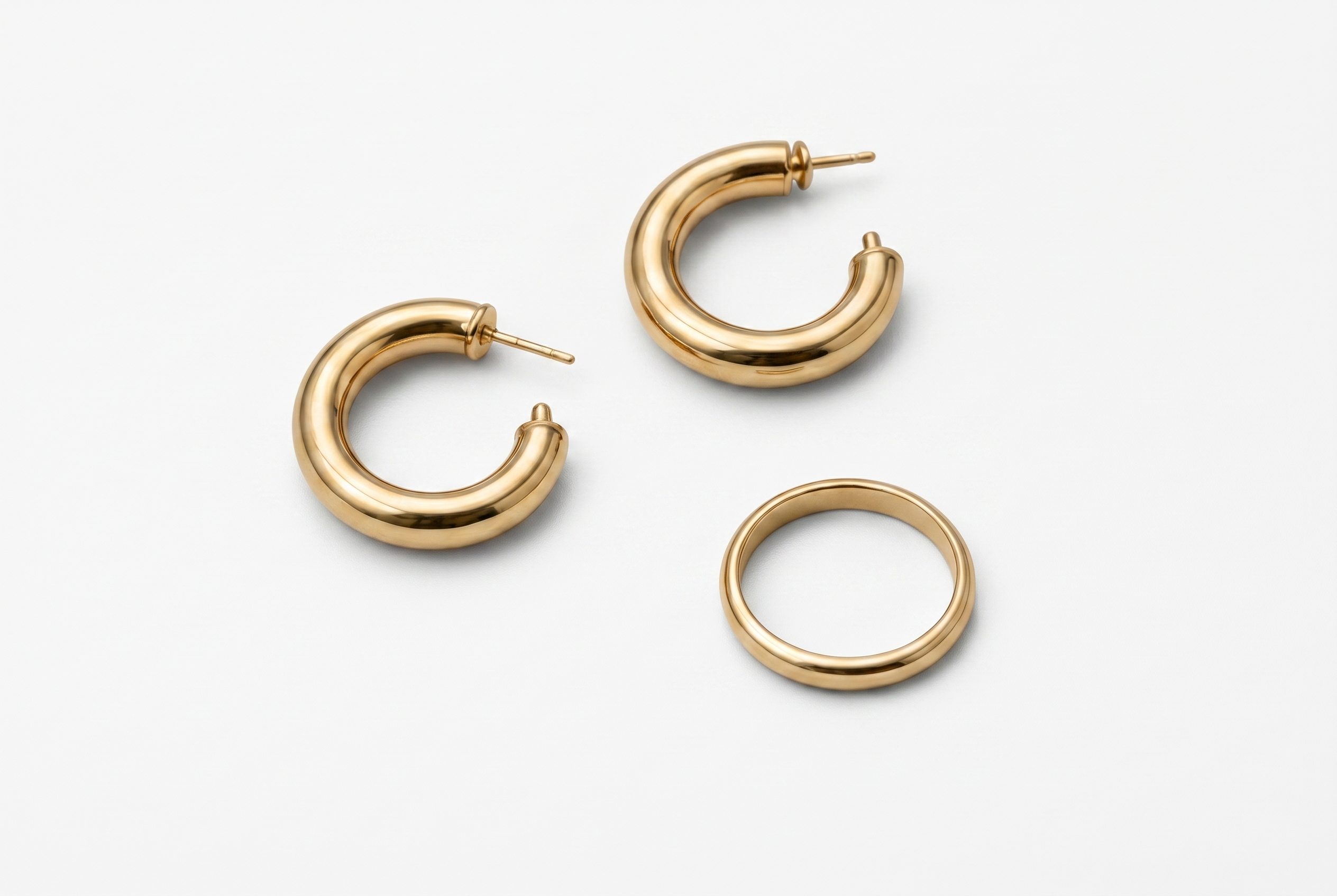 White Background Product Photos before image showing minimal gold ring on white fabric for jewelry packshot
