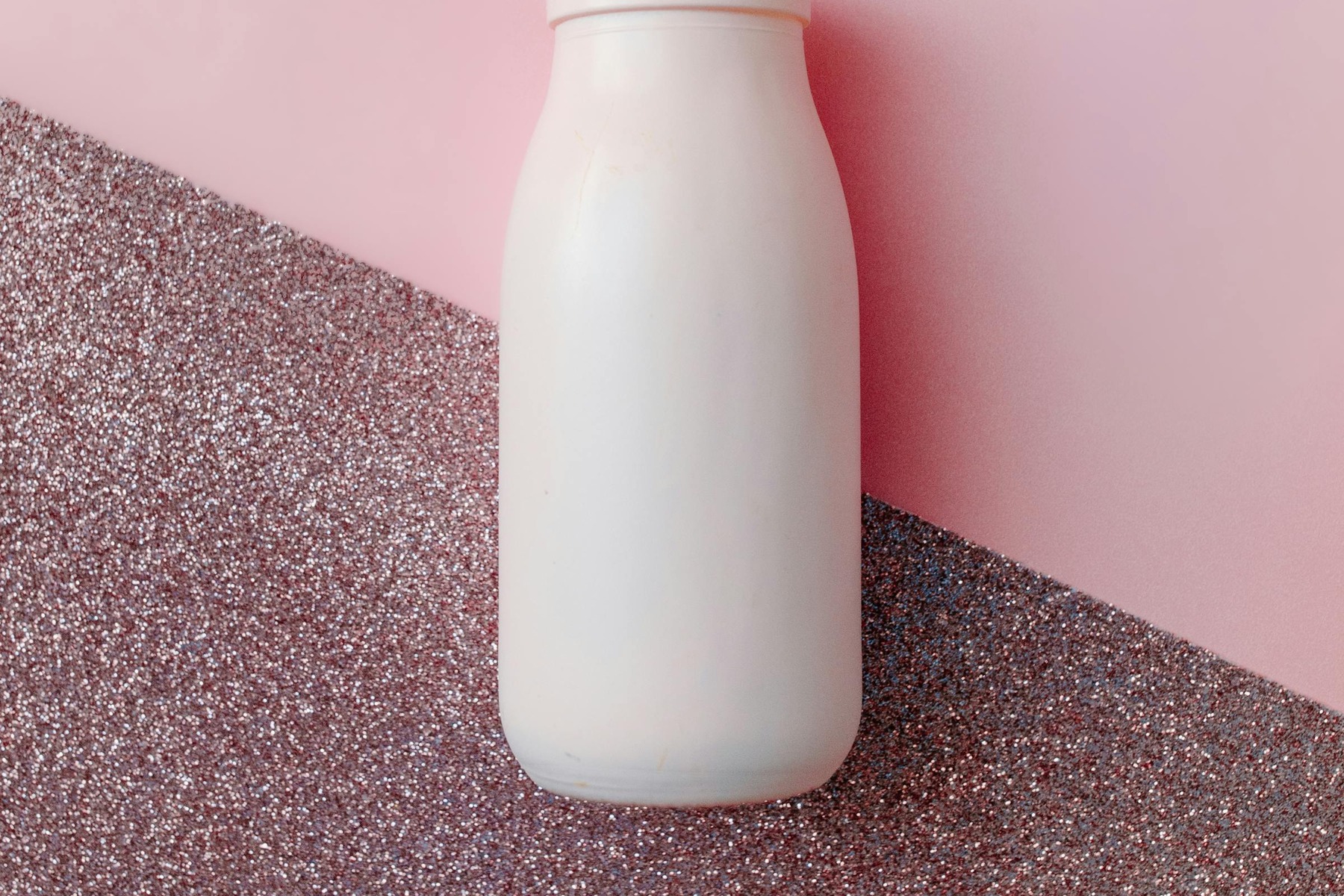 AI Background Generator for Product Photos before image showing white plastic bottle without label for clean backdrop