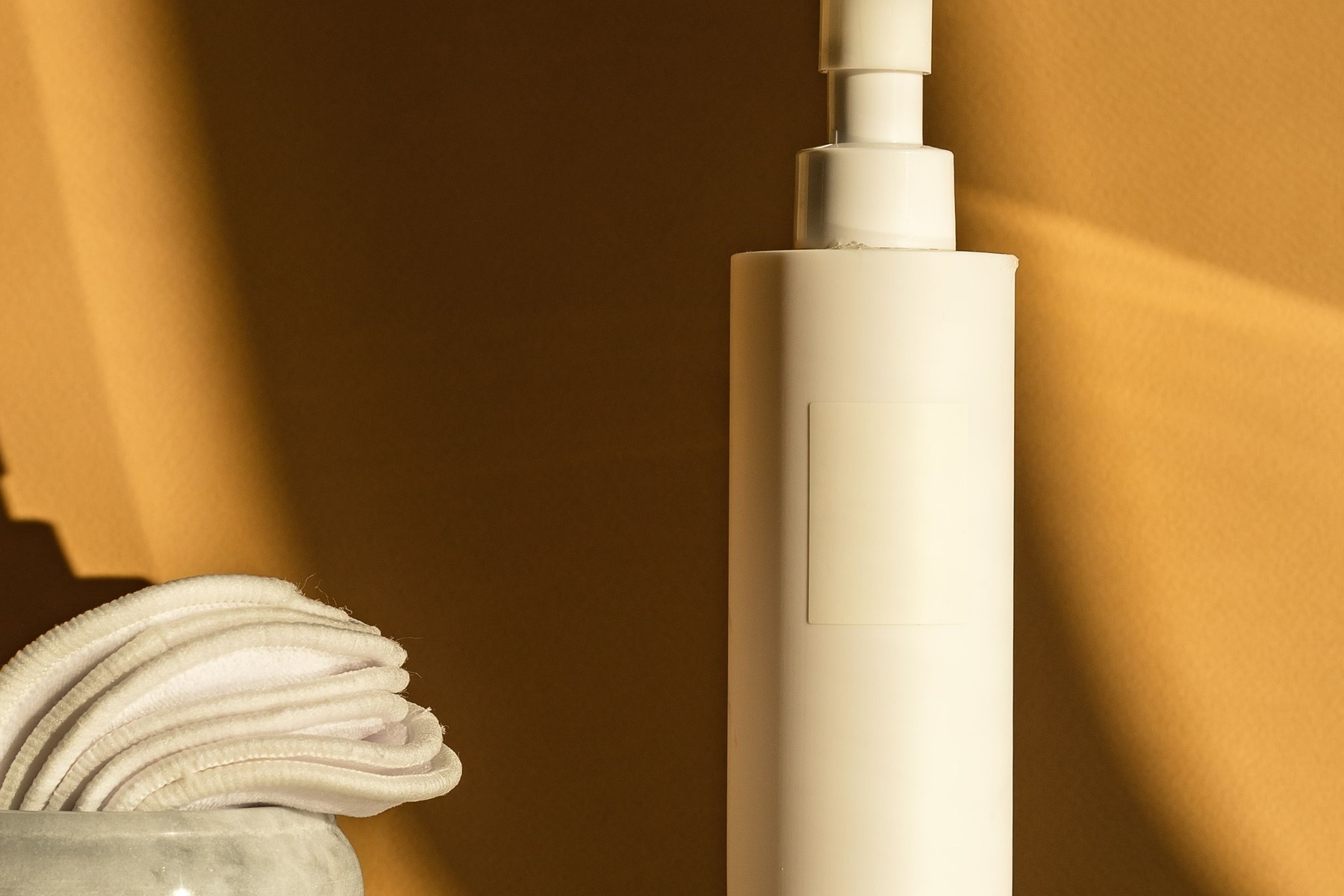 Bulk Product Image Generation before image showing white cosmetic pump bottle on beige background for soap dispenser batch