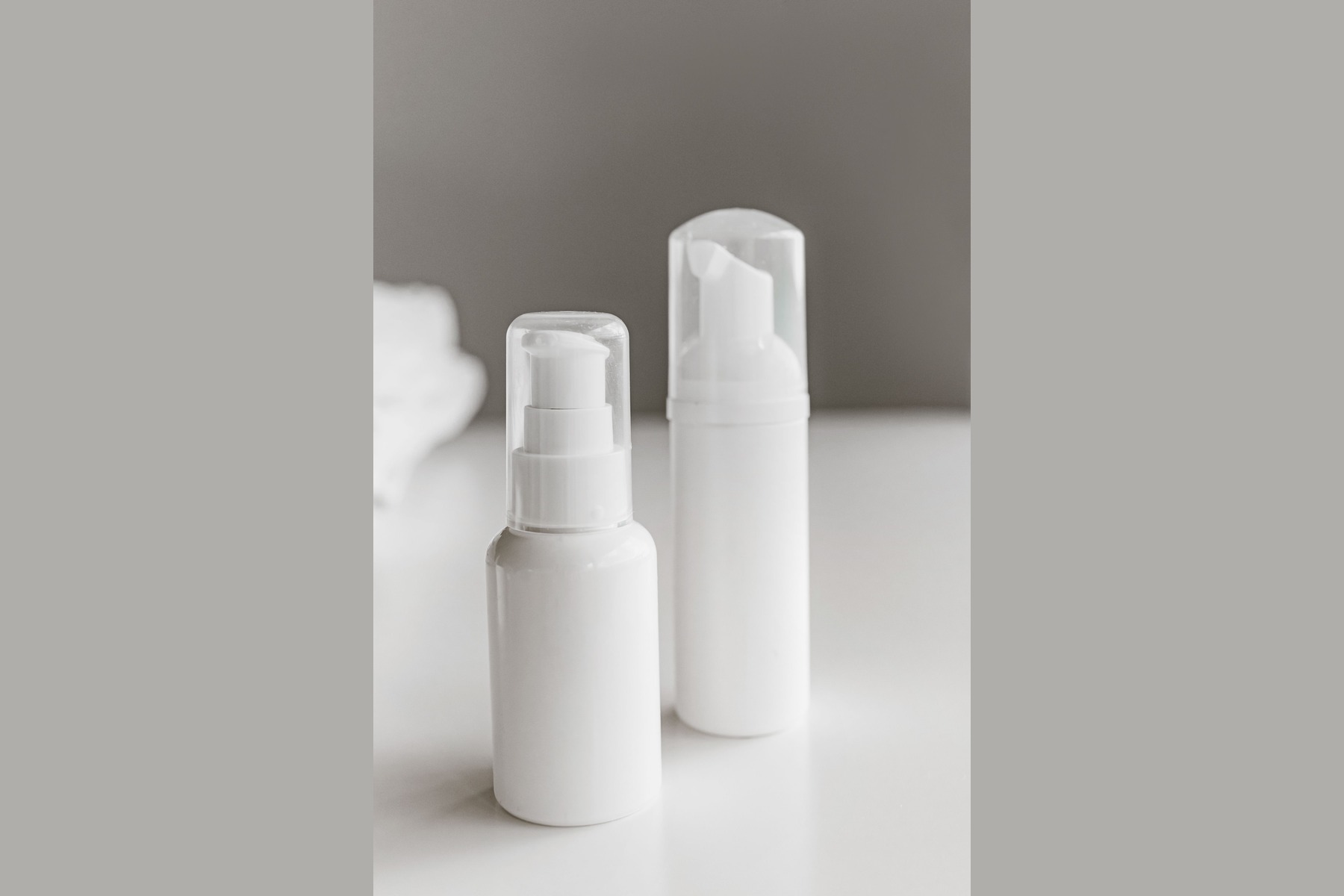 Bulk Product Image Generation before image showing two unbranded white pump bottles for beauty sku batch