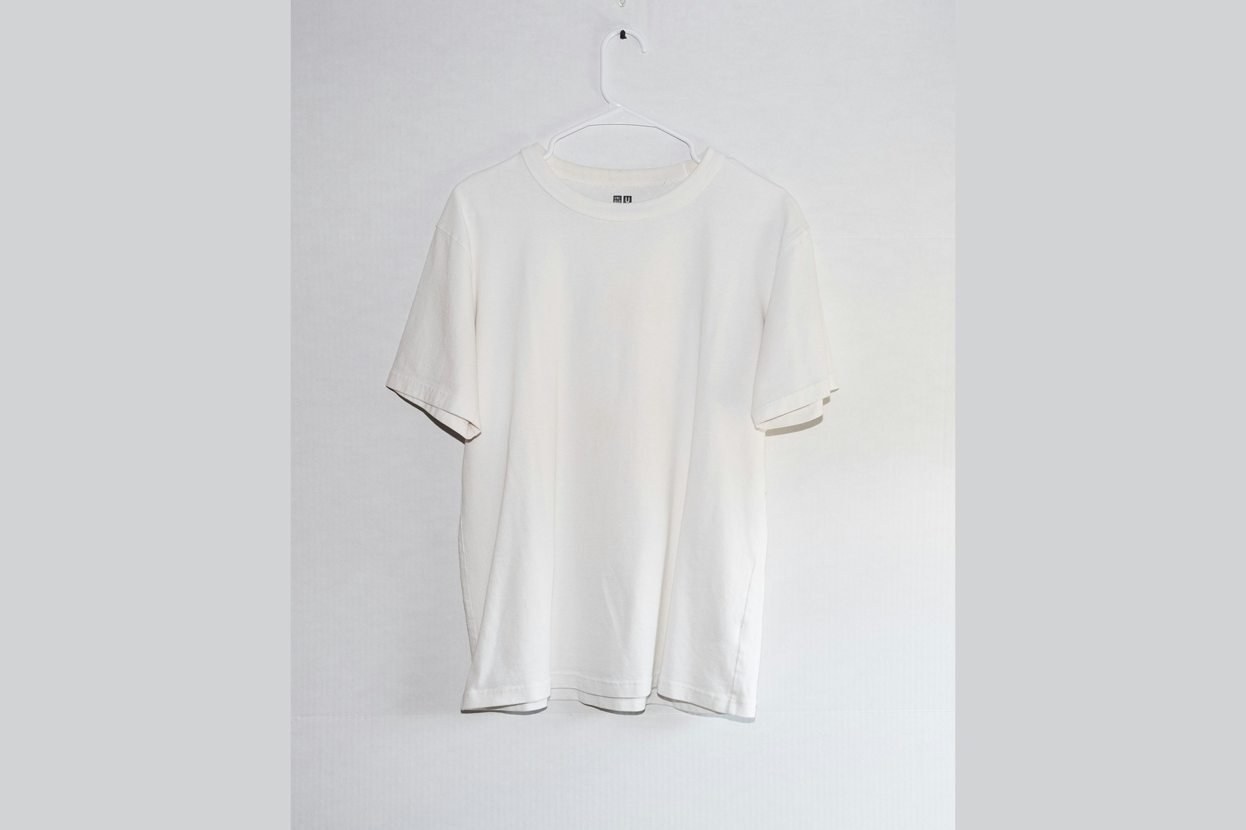 AI Model Generator for Product Photos before image showing white t-shirt for shirt on model