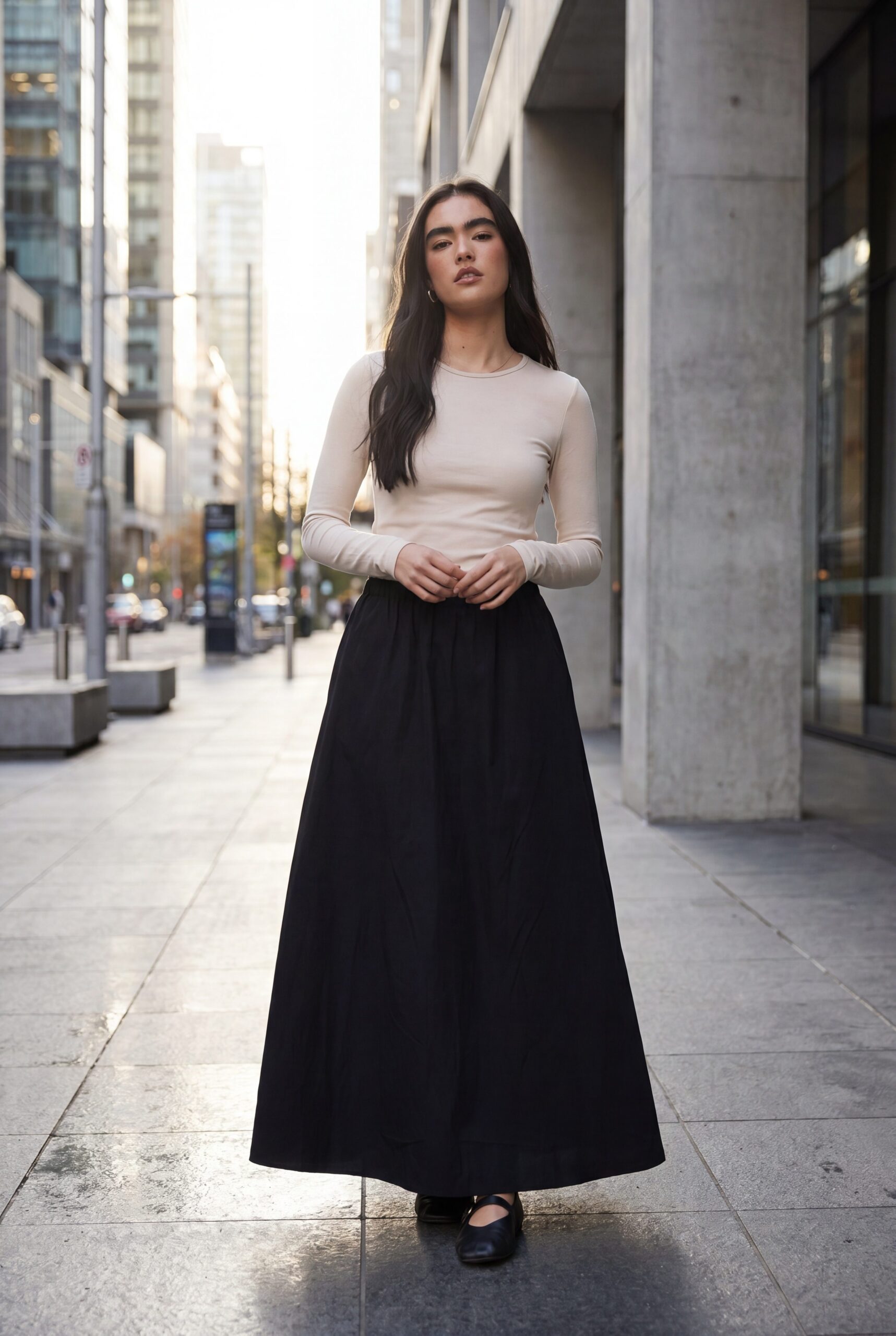 Fotogenic AI apparel example showing a black skirt outfit on an adult model in an urban ecommerce scene.