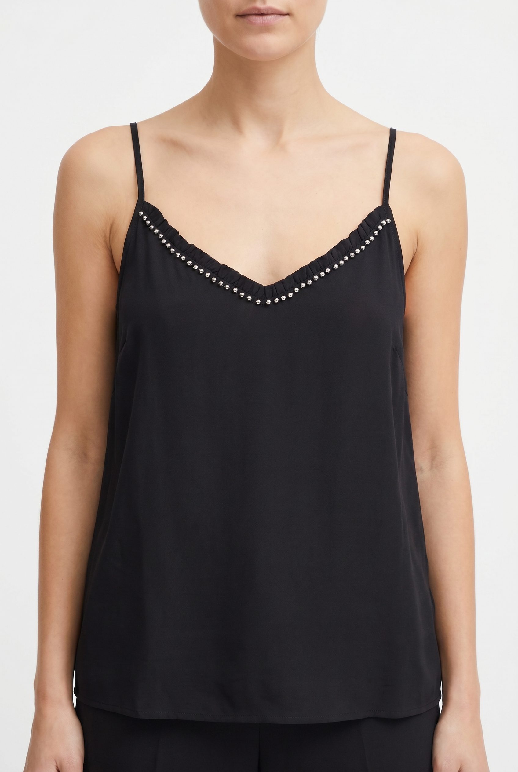 Fotogenic AI WordPress apparel visual showing a black camisole catalog shot
