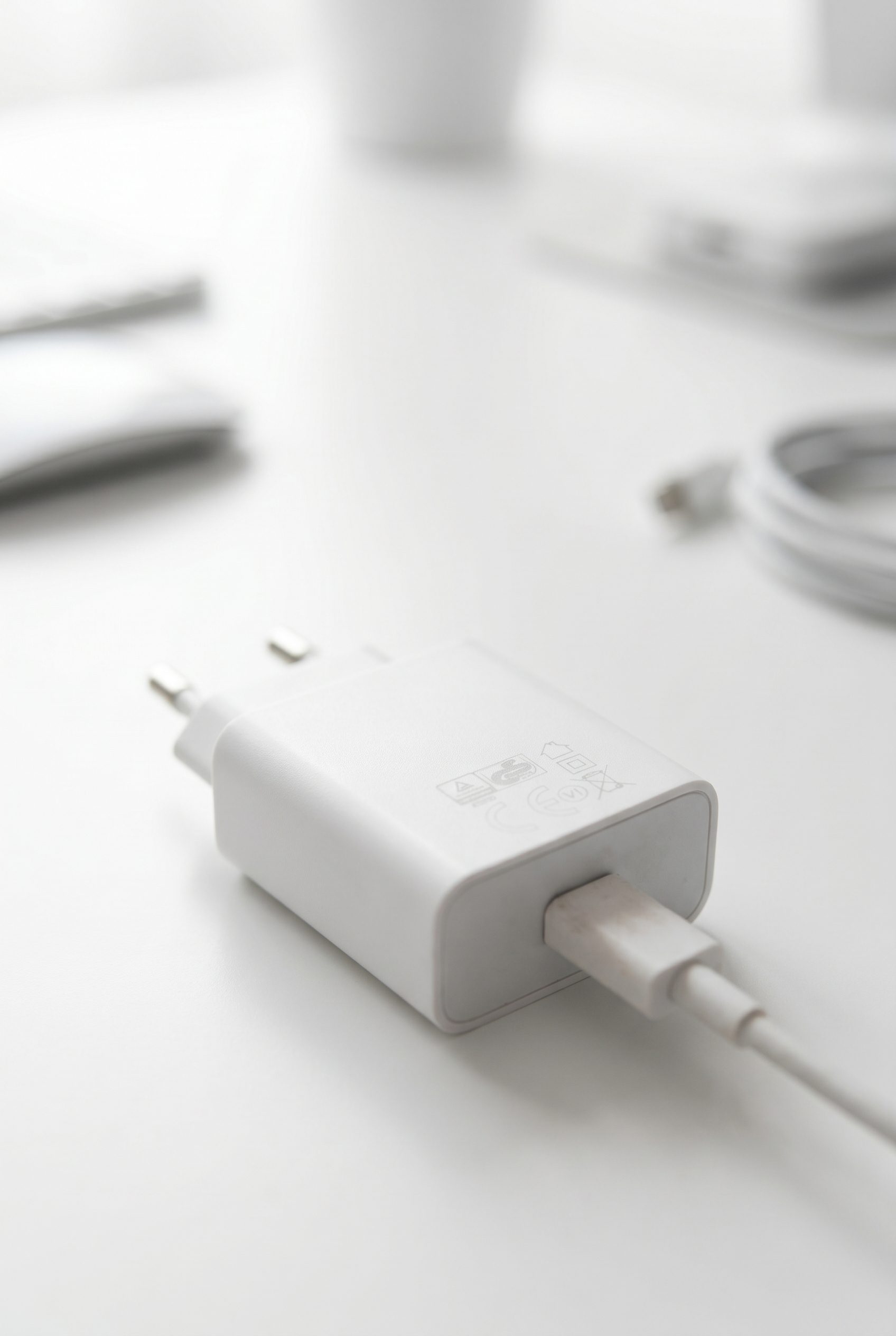 Fotogenic AI white USB charger desk setup image for electronics product photography examples.