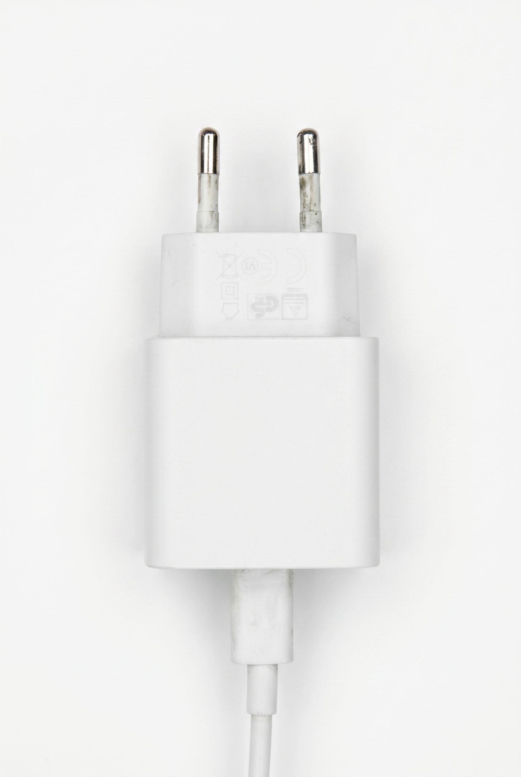 Wireless charger hero Fotogenic AI WordPress electronics visual showing a white USB charger main image