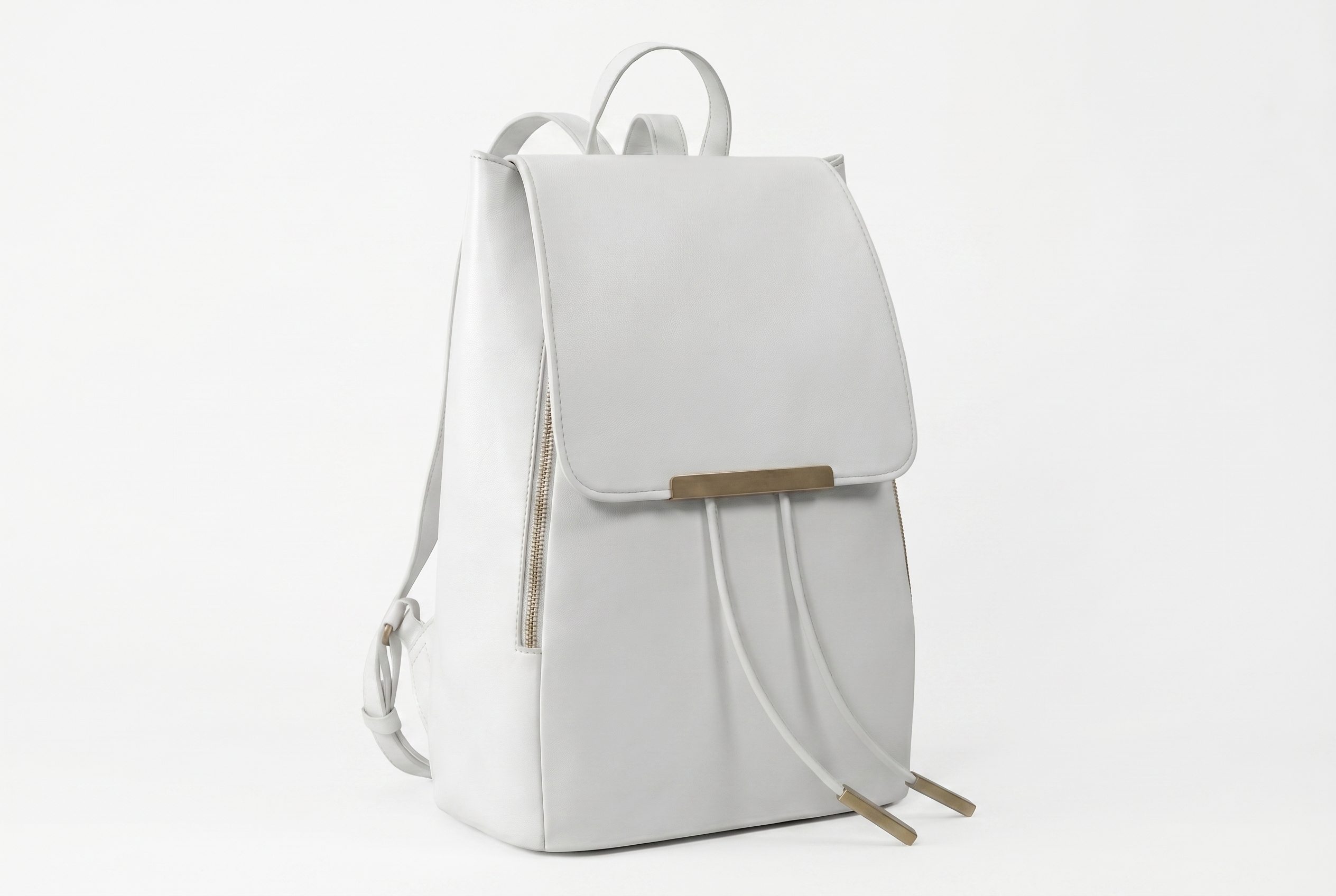 Bags product photography catalog card showing a white backpack upright with straps and hardware visible