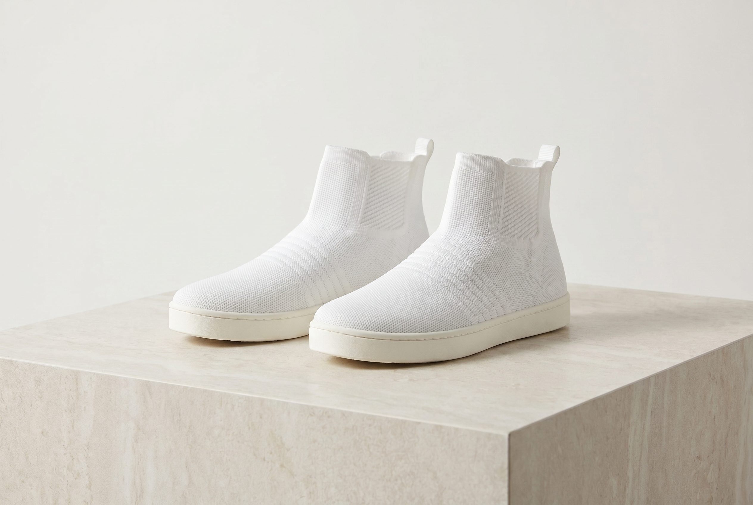 White knit sneakers for a footwear product photography hero gallery