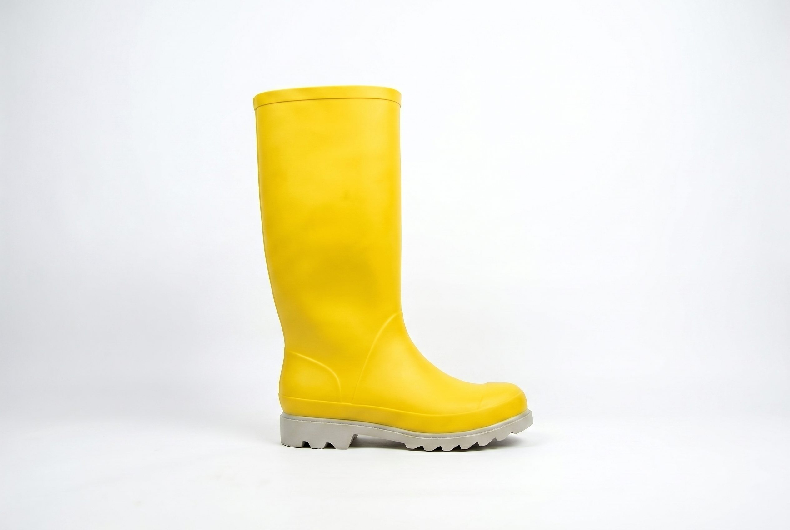 Full yellow rain boot side profile for the footwear product photography solo seller tab