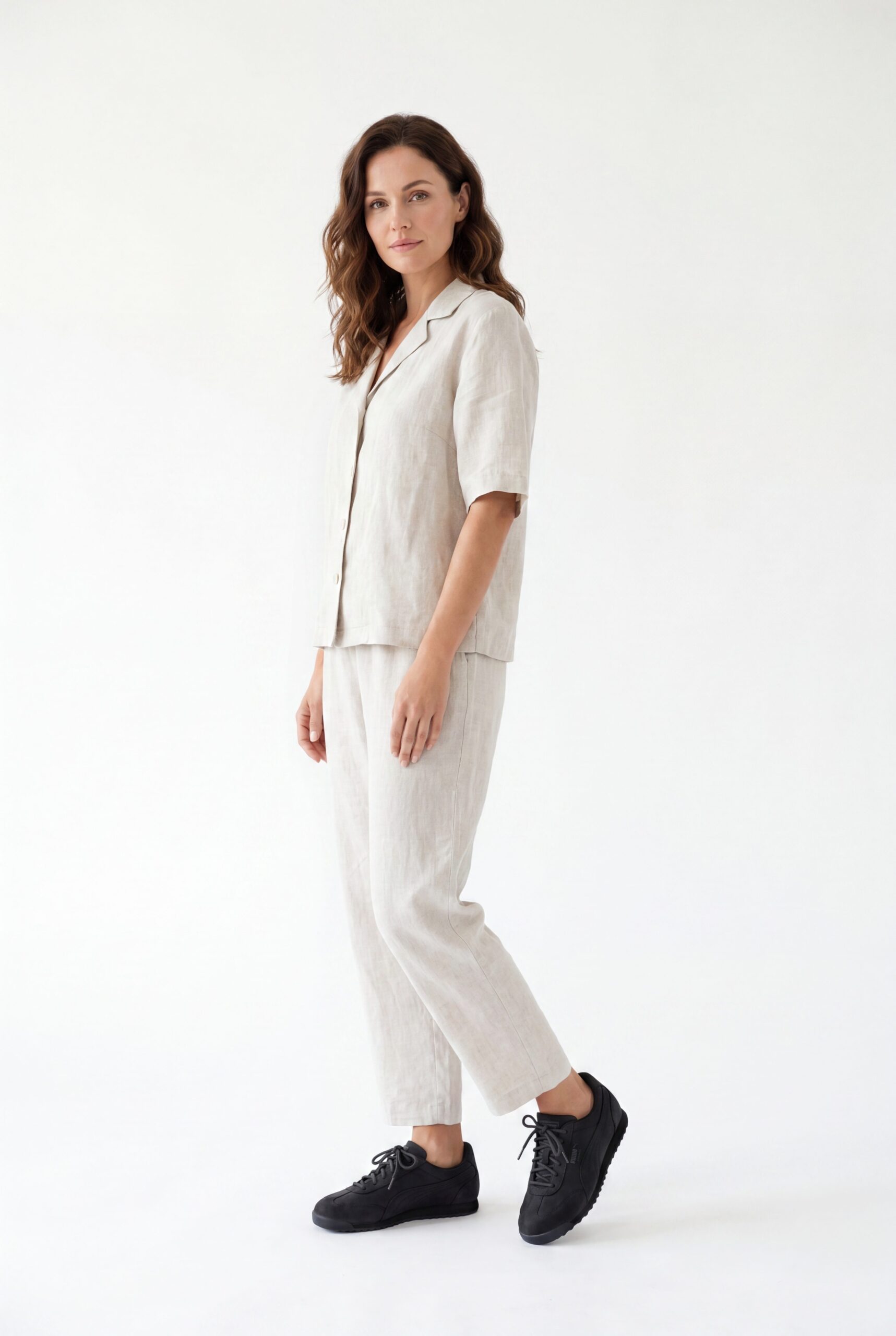 Model wearing black footwear in a clean studio catalog pose for ecommerce product images.