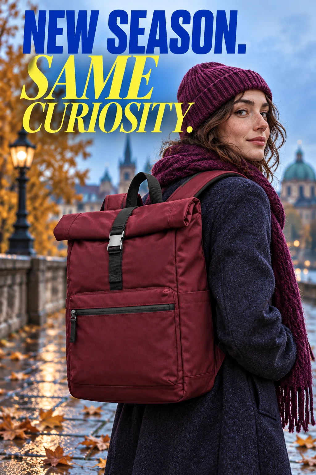 Burgundy rolltop backpack campaign, standing on damp ochre paving with scattered rust autumn leaves and a folded plum scarf, cool blue morning light