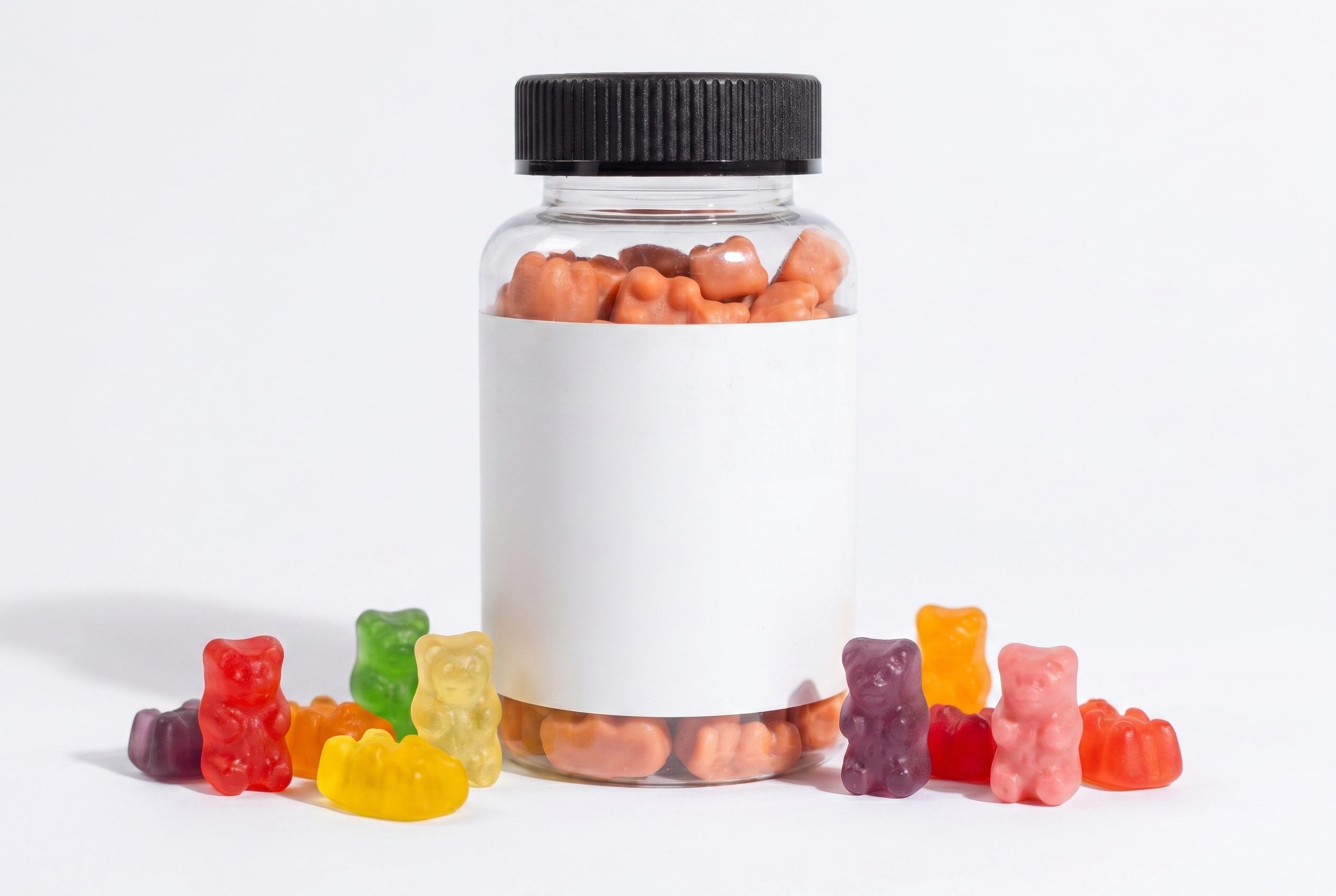 Brand-free gummy vitamin jar with colorful gummies for supplement product photography.