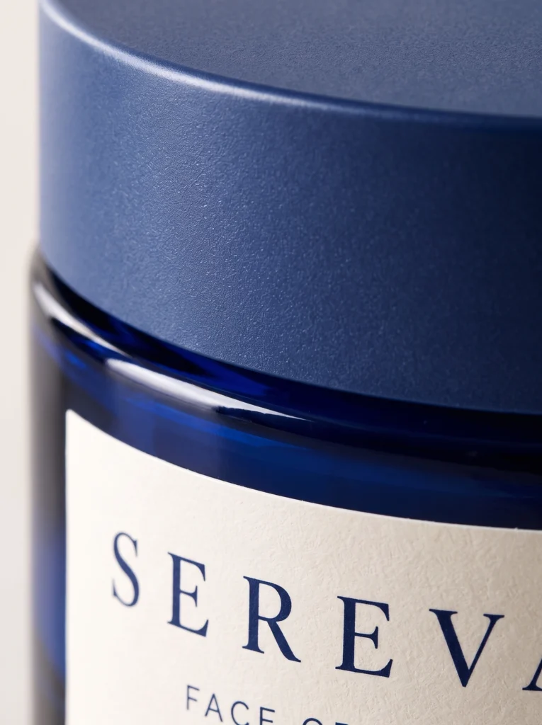 Close view of the SEREVA jar matte lid, cobalt glass and cream label edge.